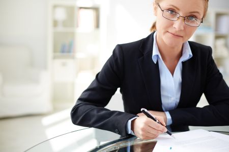 close-up-executive-signing-agreement